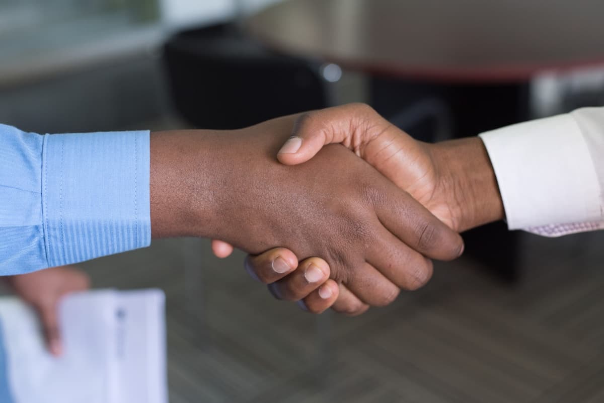 Business owners managing orders and sales from a smartphone